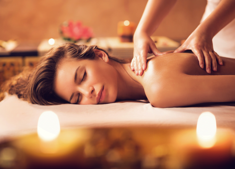Young woman relaxing during massage at the spa